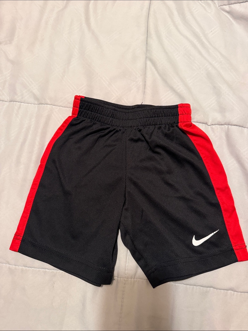 Nike Kids Black Shorts with Red Side Panels